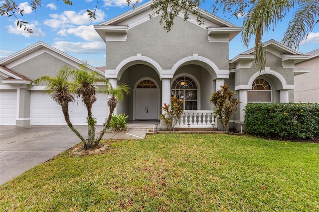 view of front of house featuring a garage and a front yard