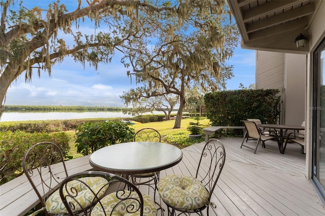 wooden deck featuring a water view