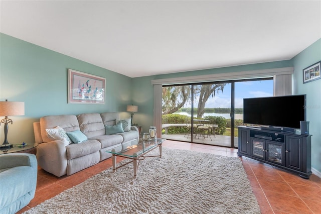 living room with tile patterned floors and plenty of natural light