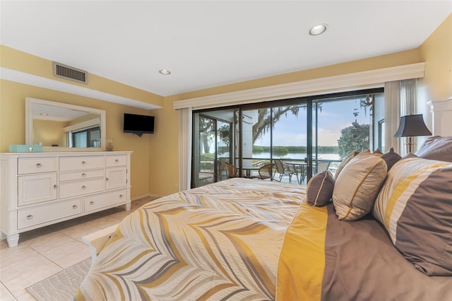 tiled bedroom featuring access to outside