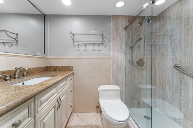 bathroom featuring toilet, walk in shower, tile walls, tile patterned floors, and vanity