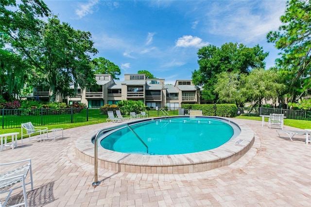 view of swimming pool with a patio