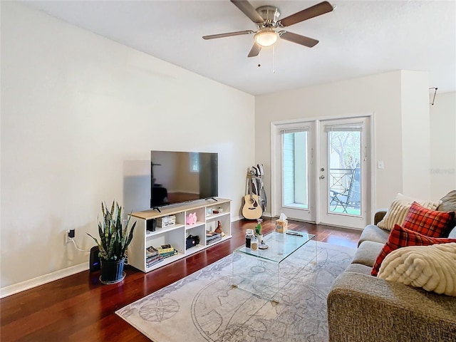 living room featuring hardwood / wood-style flooring and ceiling fan