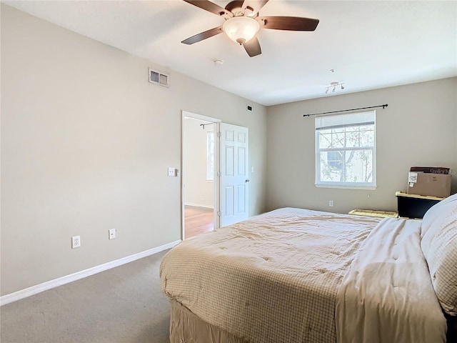 carpeted bedroom with ceiling fan