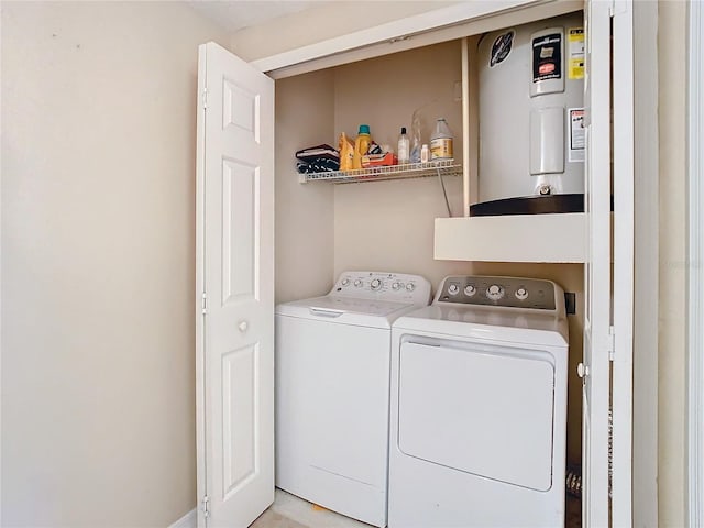 laundry area featuring washer and dryer and electric water heater