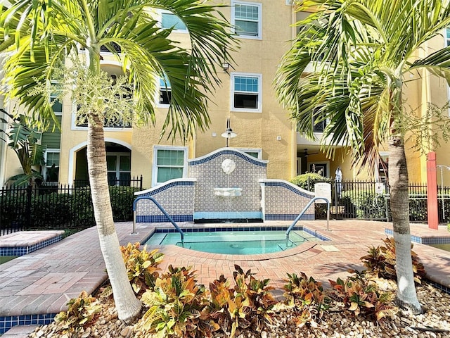 view of pool featuring a hot tub