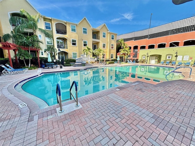 view of swimming pool with a patio area