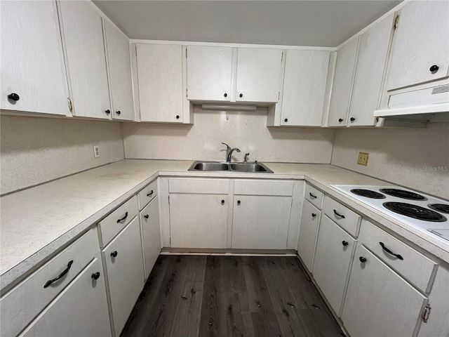 kitchen with sink, white cabinetry, dark hardwood / wood-style floors, and white electric cooktop