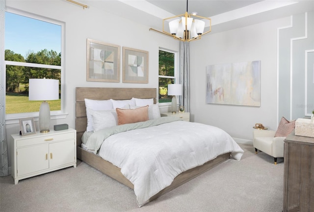 bedroom featuring a chandelier, light carpet, and multiple windows