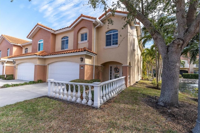 mediterranean / spanish house with a garage and a porch