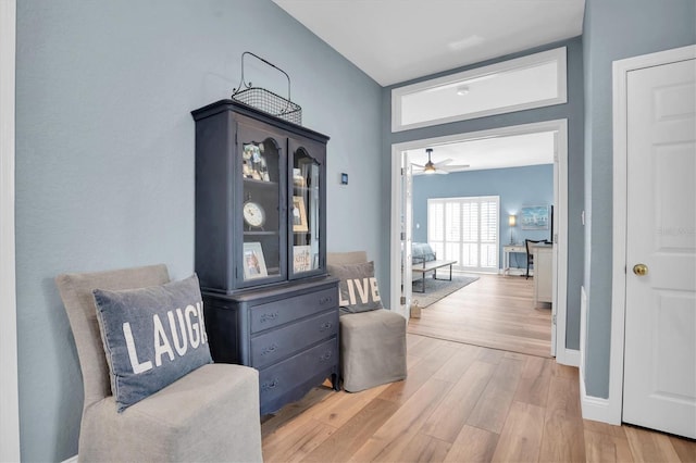 hallway with light hardwood / wood-style flooring