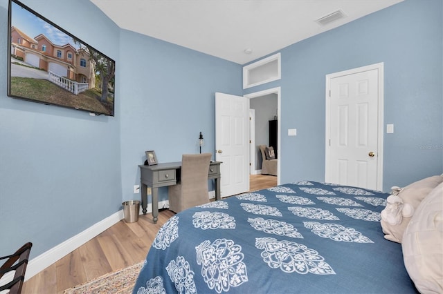 bedroom featuring hardwood / wood-style floors