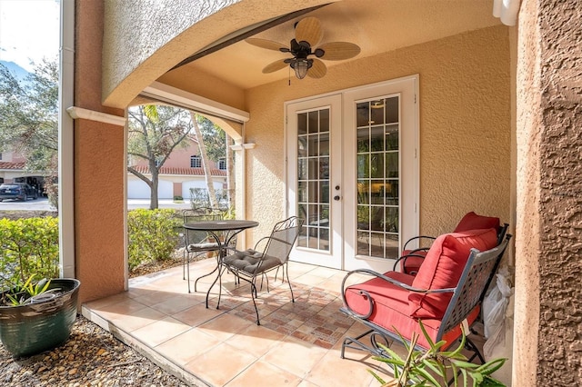 view of patio featuring french doors and ceiling fan