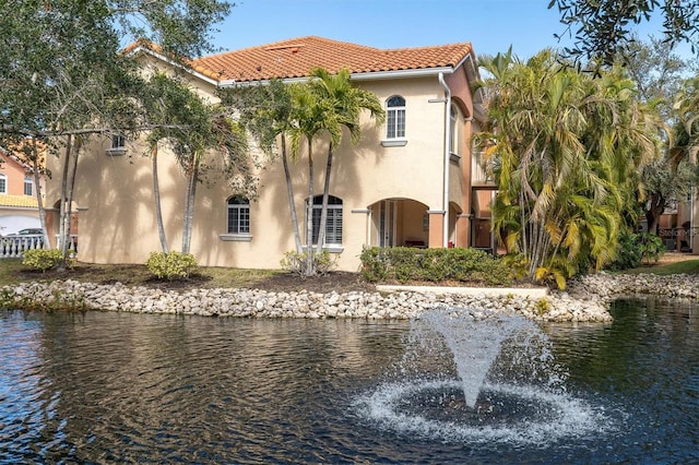 exterior space with a water view