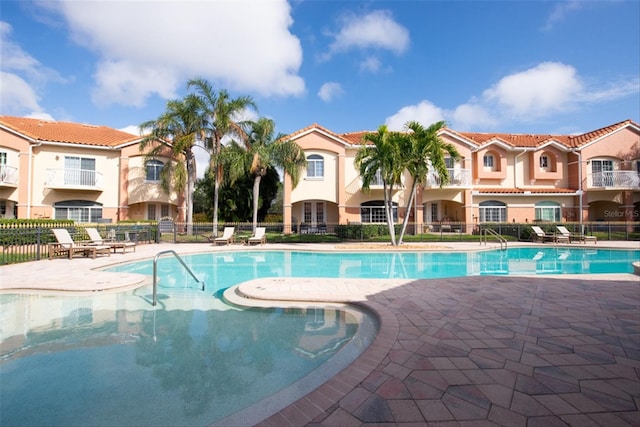 view of swimming pool with a patio area