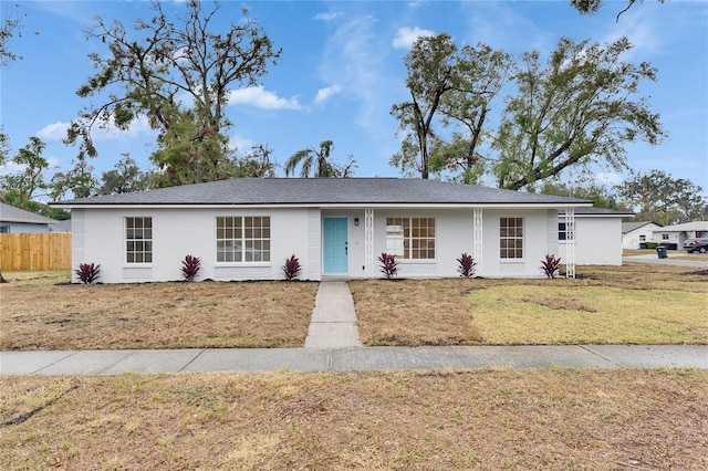 single story home with a front yard