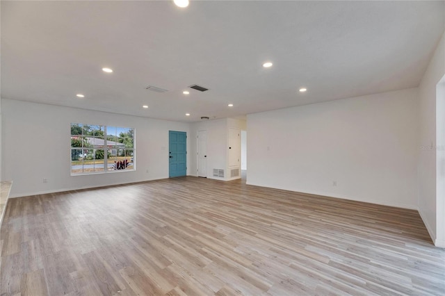 unfurnished living room with light hardwood / wood-style floors