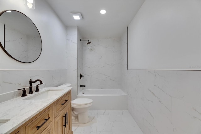 full bathroom with vanity, toilet, tiled shower / bath, and tile walls