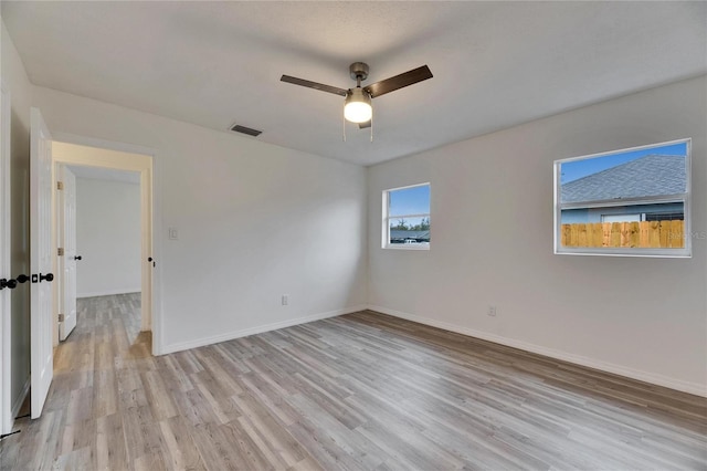 unfurnished room with ceiling fan and light hardwood / wood-style flooring