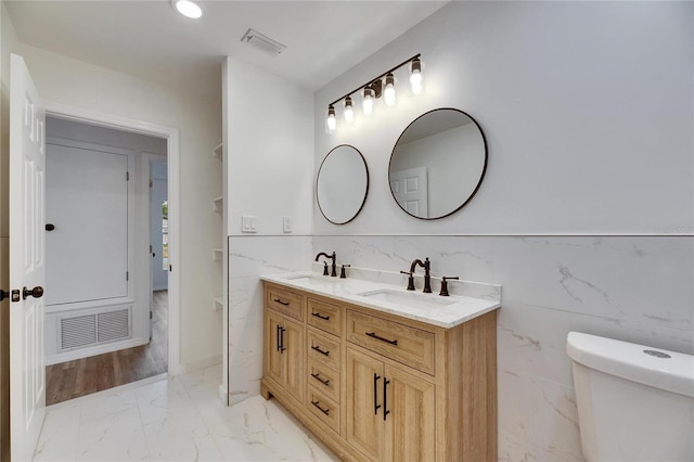 bathroom with toilet and vanity