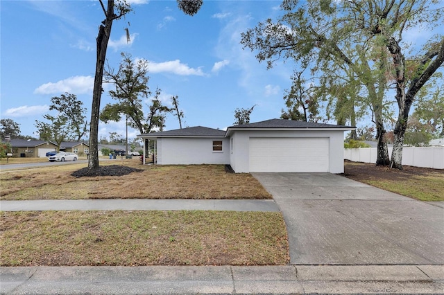 ranch-style house with a garage and a front yard