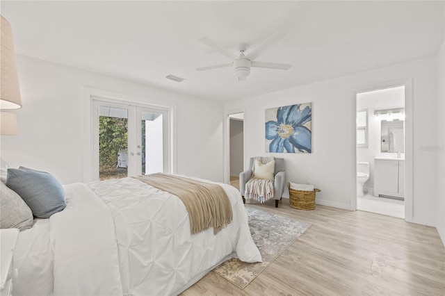 bedroom with french doors, ensuite bath, light wood-type flooring, ceiling fan, and access to exterior