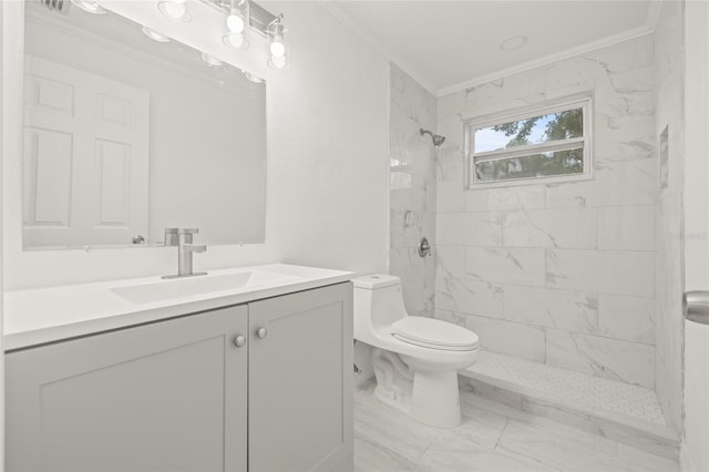 bathroom featuring a tile shower, vanity, crown molding, and toilet