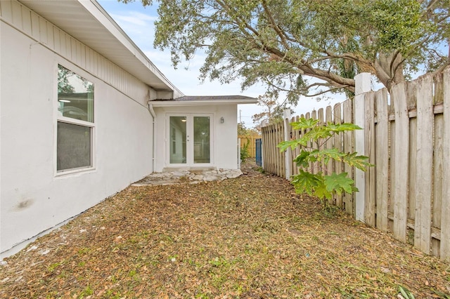 view of yard featuring french doors