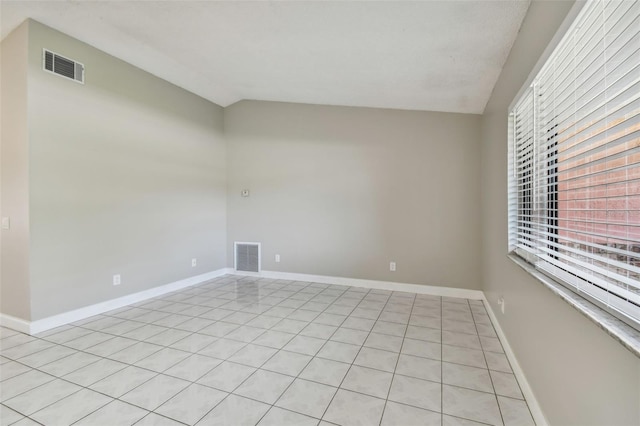 empty room with vaulted ceiling