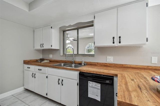 kitchen with wood counters, sink, white cabinetry, black dishwasher, and ceiling fan