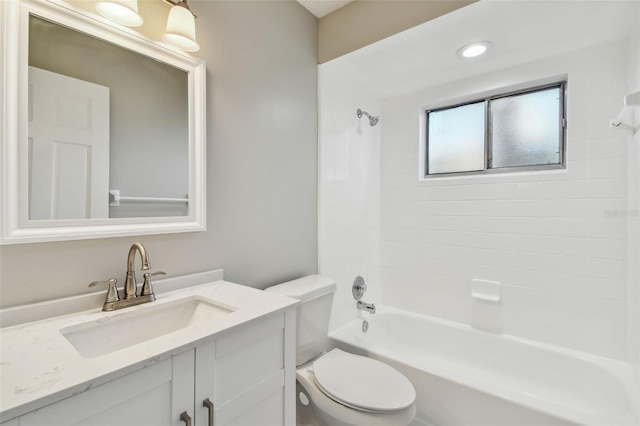 full bathroom with vanity, toilet, and tiled shower / bath