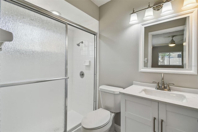 bathroom with walk in shower, vanity, and toilet