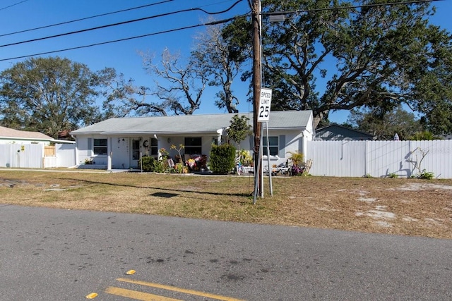 view of front of house with a front yard and a porch