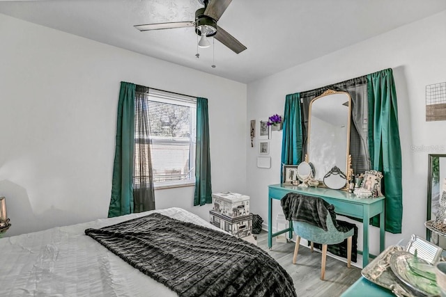 bedroom featuring wood-type flooring and ceiling fan