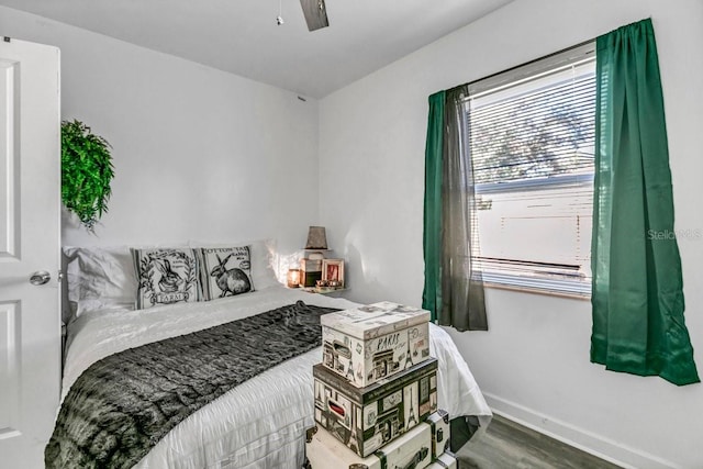 bedroom featuring ceiling fan and hardwood / wood-style flooring