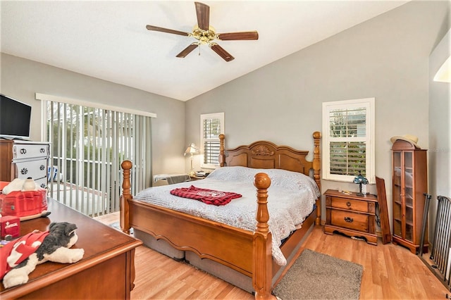 bedroom featuring ceiling fan, light hardwood / wood-style flooring, lofted ceiling, and access to outside