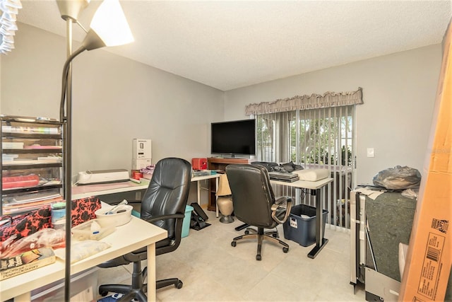 home office featuring a textured ceiling