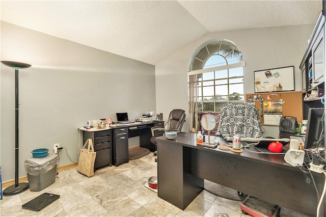 office space featuring a textured ceiling and lofted ceiling