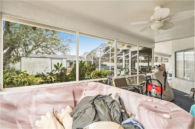 sunroom / solarium with ceiling fan