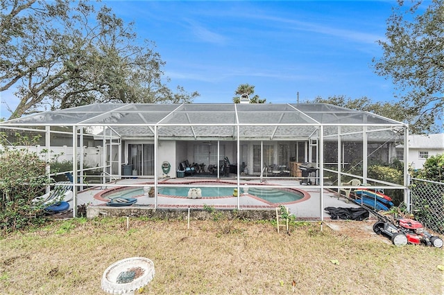 back of property featuring a lanai and a patio