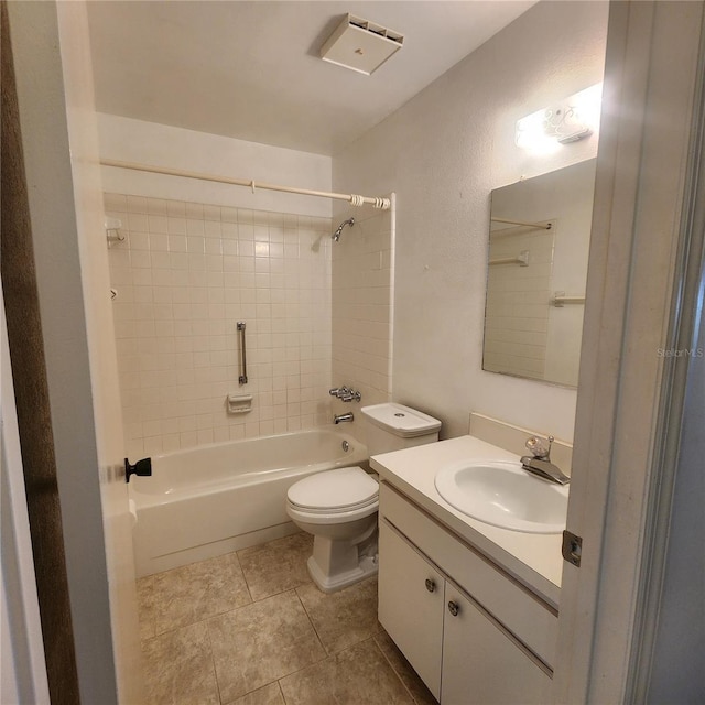 bathroom with toilet, vanity, washtub / shower combination, and tile patterned floors