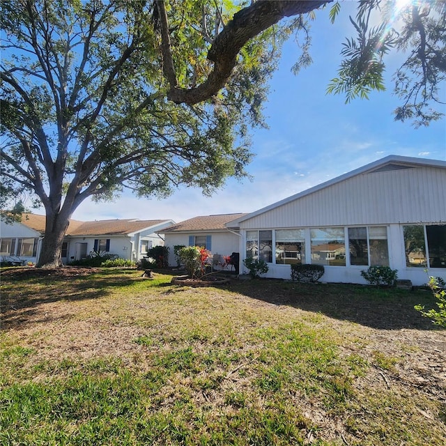 view of home's exterior with a yard