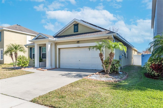 view of front of house with a garage and a front yard