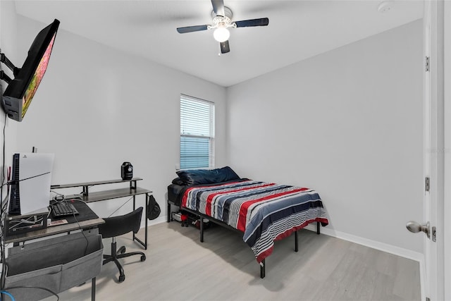 bedroom featuring light wood-type flooring and ceiling fan