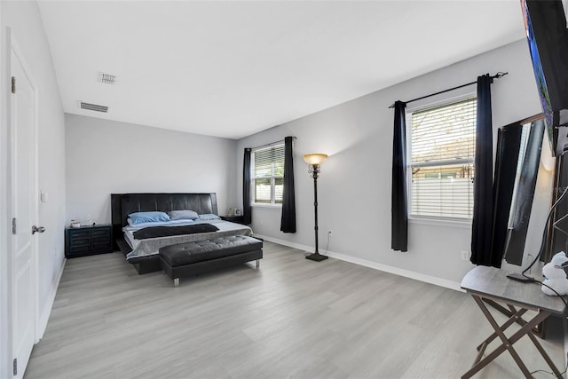 bedroom with light hardwood / wood-style floors