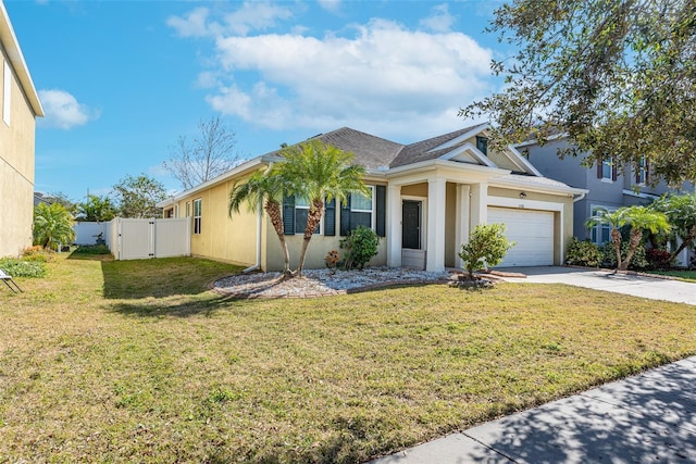 view of front of house with a garage and a front yard