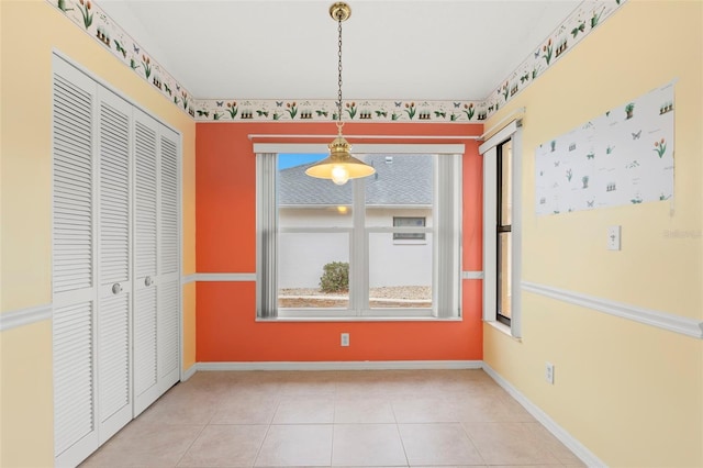 unfurnished dining area with light tile patterned floors