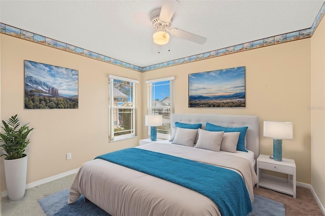 bedroom with ceiling fan and carpet floors