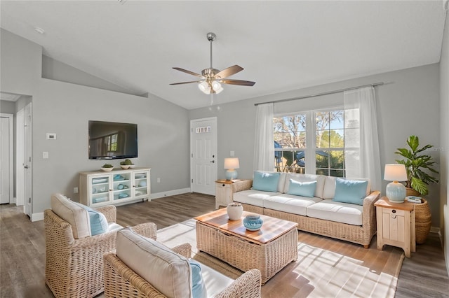 living room featuring ceiling fan, lofted ceiling, and wood-type flooring