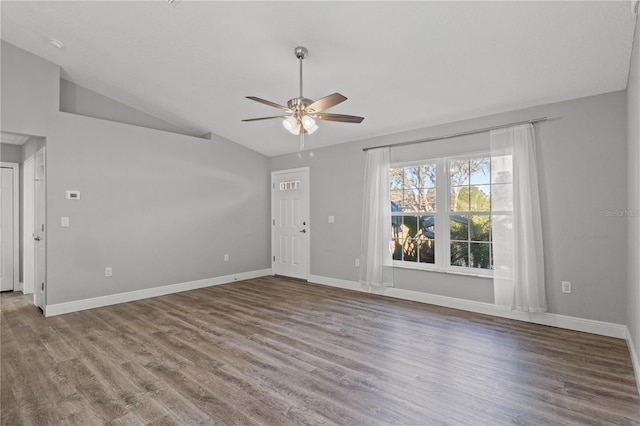 unfurnished living room with wood-type flooring, vaulted ceiling, and ceiling fan